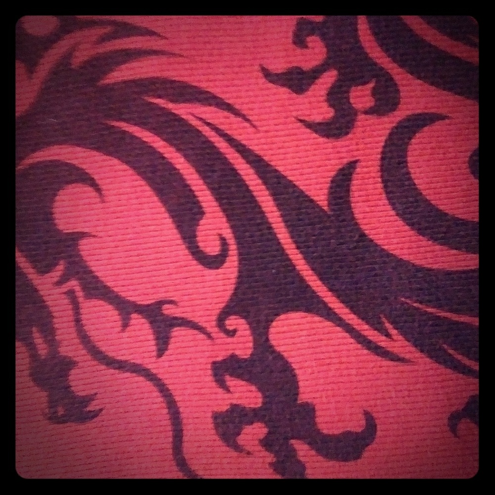 This ribbed tank top is red with black Dragon .